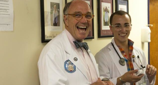 Dean Stephen Ray Mitchell and a medical student smiling, sharing a happy moment at the HOYA Clinic.