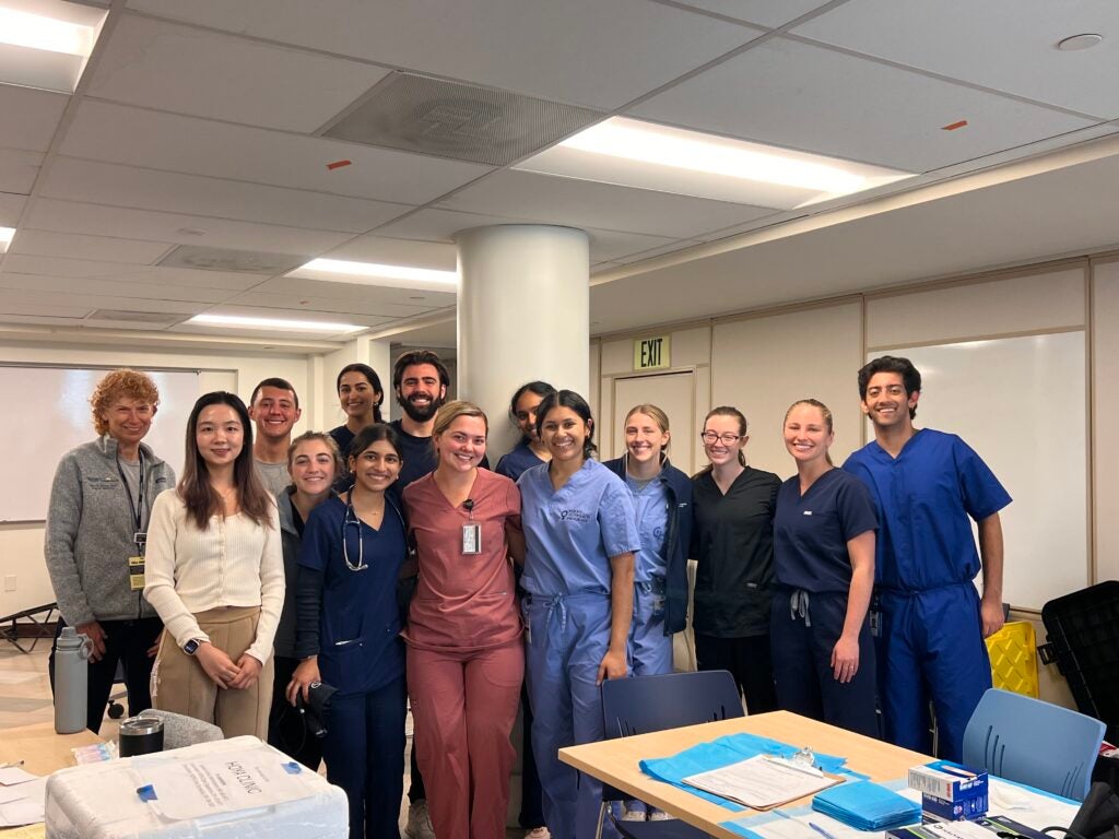 Group of volunteers posing in front of Flu Clinic site
