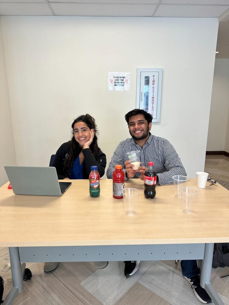 Image of volunteers tabling with sugar-sweetened beverages on the table.
