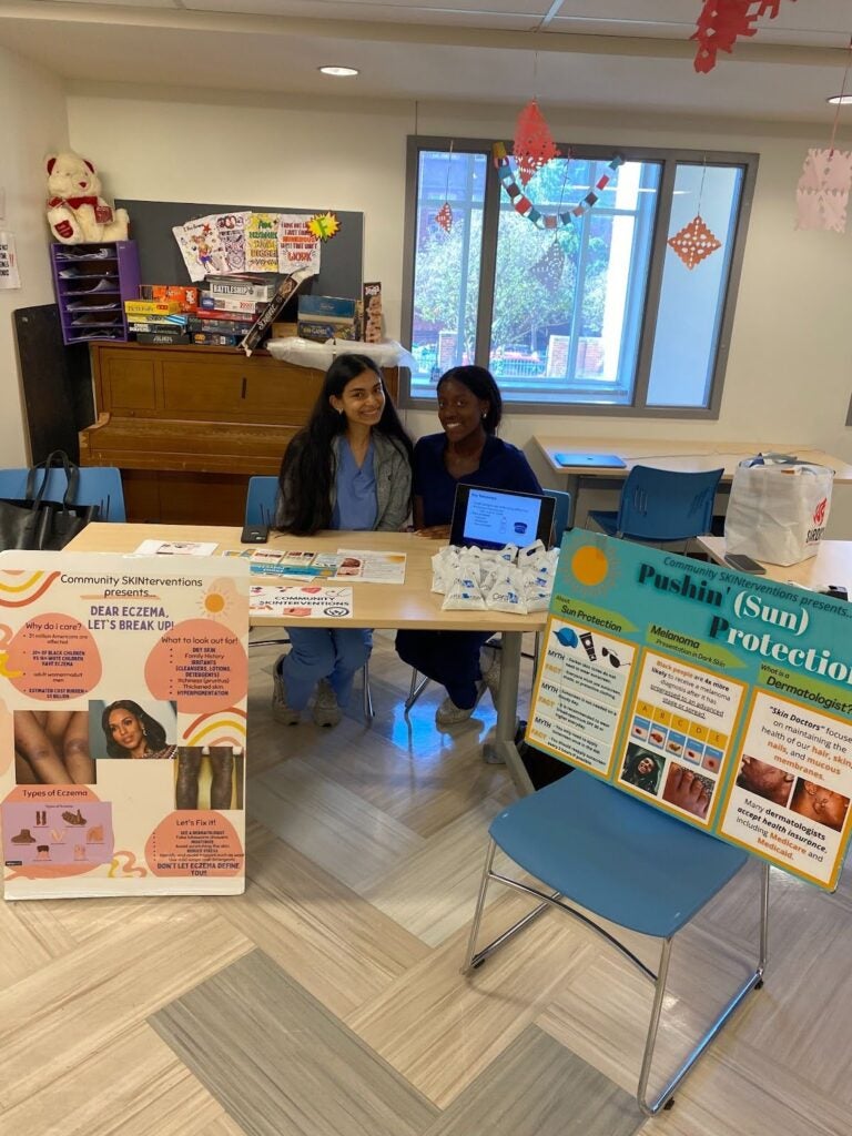 Volunteers Tabling for Wearing Sun Protection